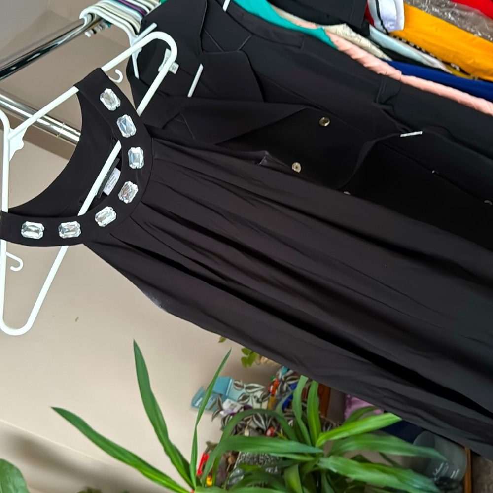 Simple, black polyester dress with big rhinestone collar